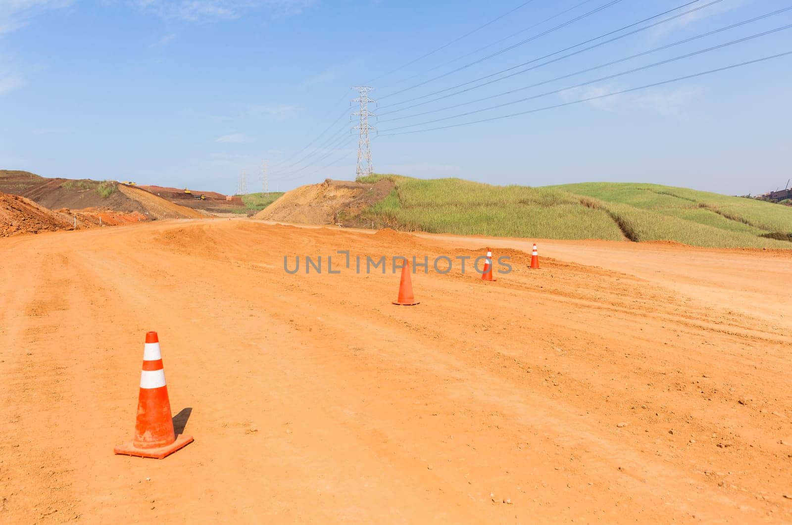 Construction new road infrastructure project development build concrete pipes earthworks industrial machines  countryside.