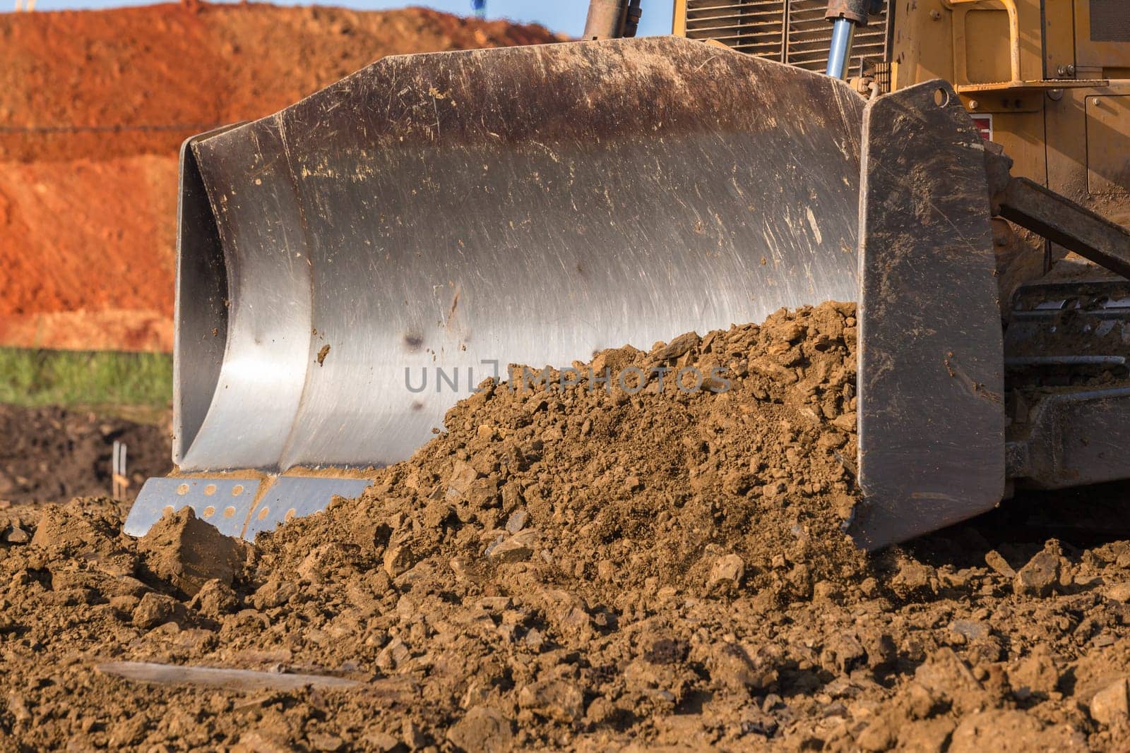 Construction industrial earthworks site  landfill grader dozer machine  leveling sand stones landscape