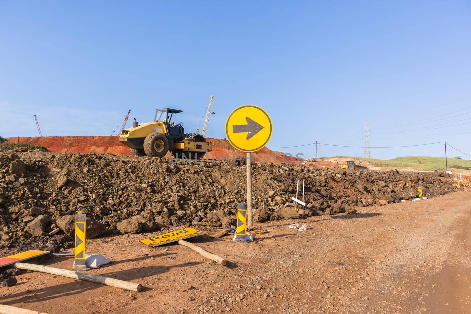 Construction industrial earthworks site  landfill grader dozer machine  leveling sand stones landscape