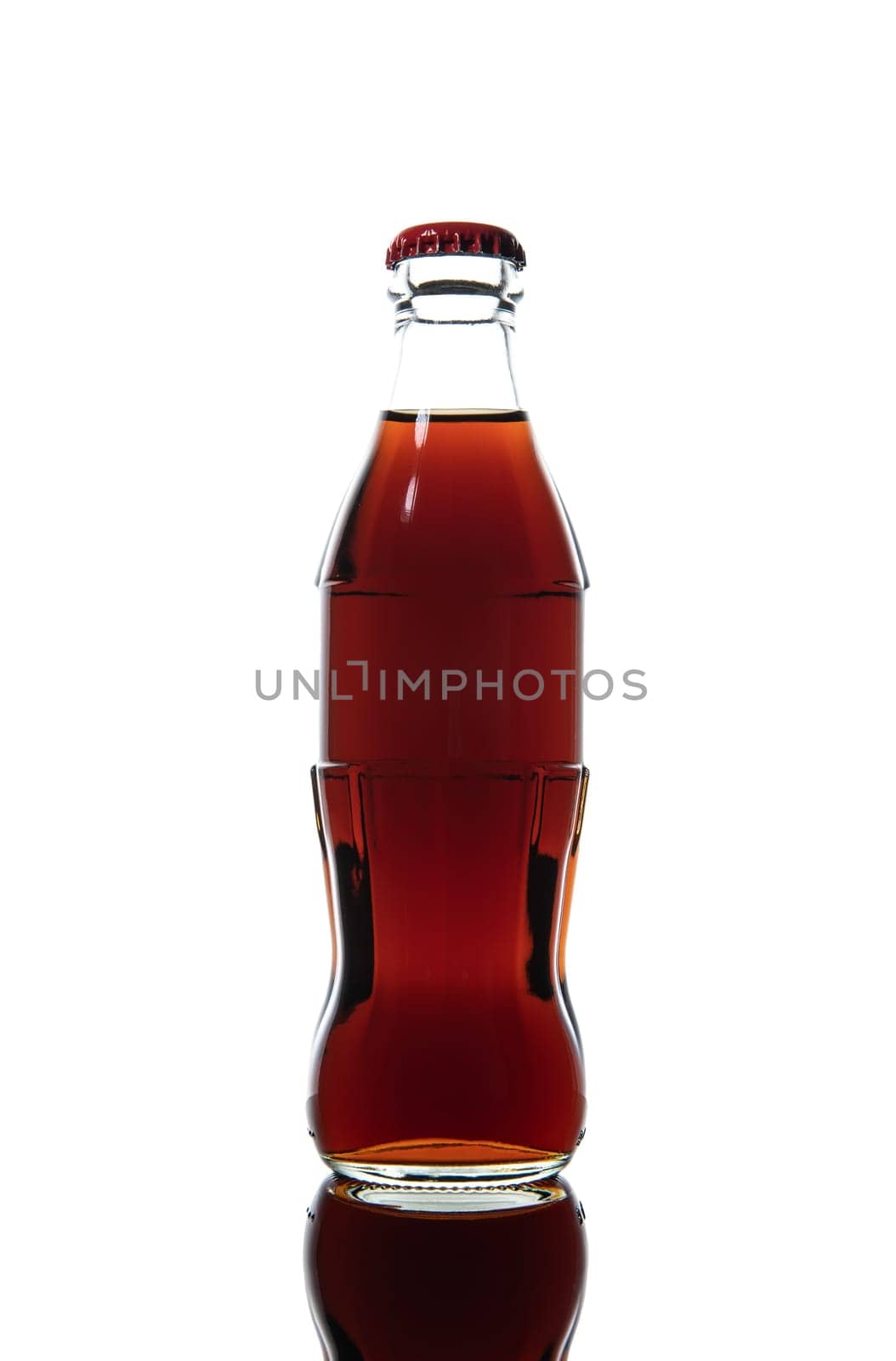 Small glas bottle of soda isolated on a white background.