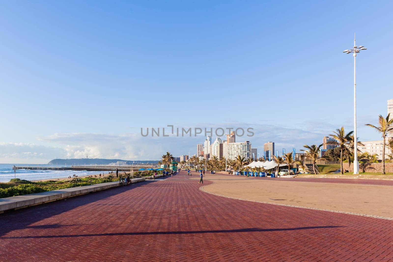 Beach Ocean Promenade Durban South-Africa Photo of beach front promenade ocean waves surfers piers cycling people lifestyle landscape.