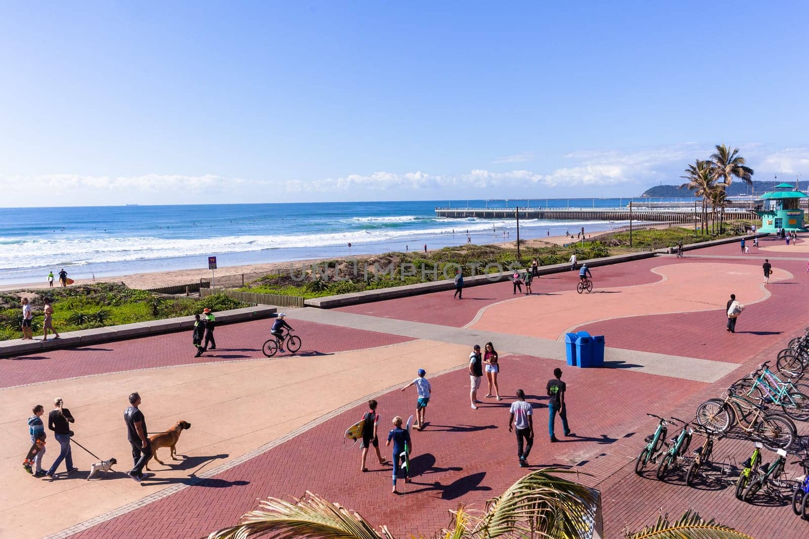Beach Ocean Promenade Durban South-Africa Photo of beach front promenade ocean waves surfers piers cycling people lifestyle landscape.