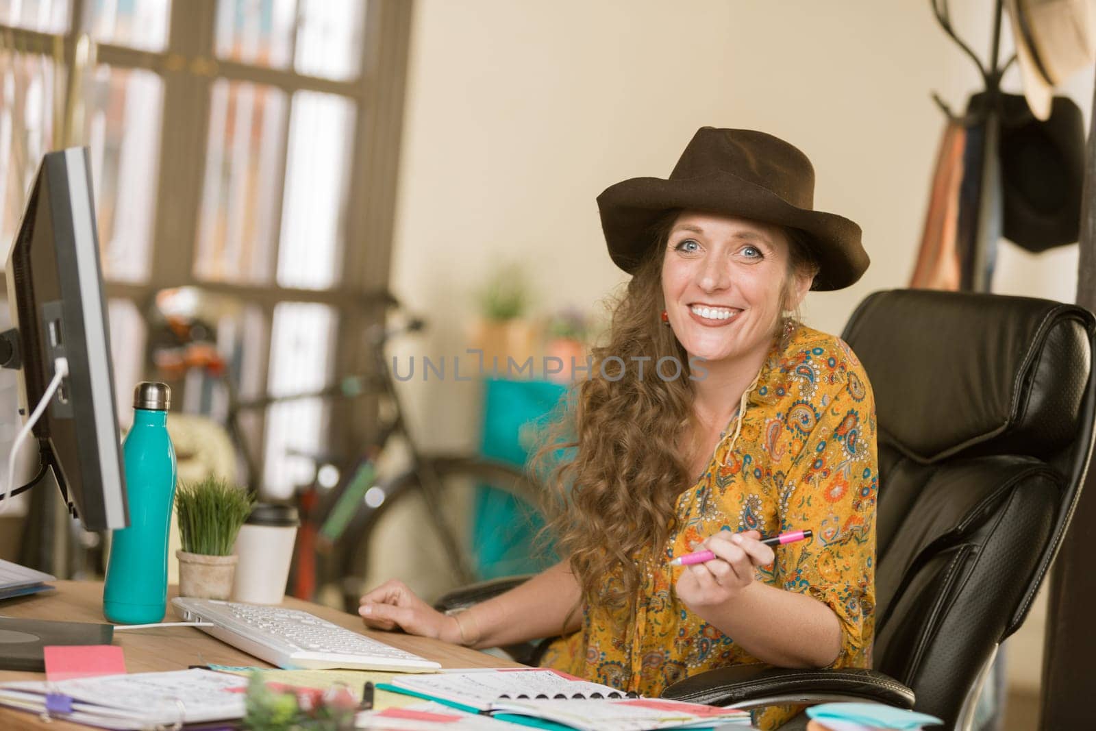 Stylish professional woman at work in her office
