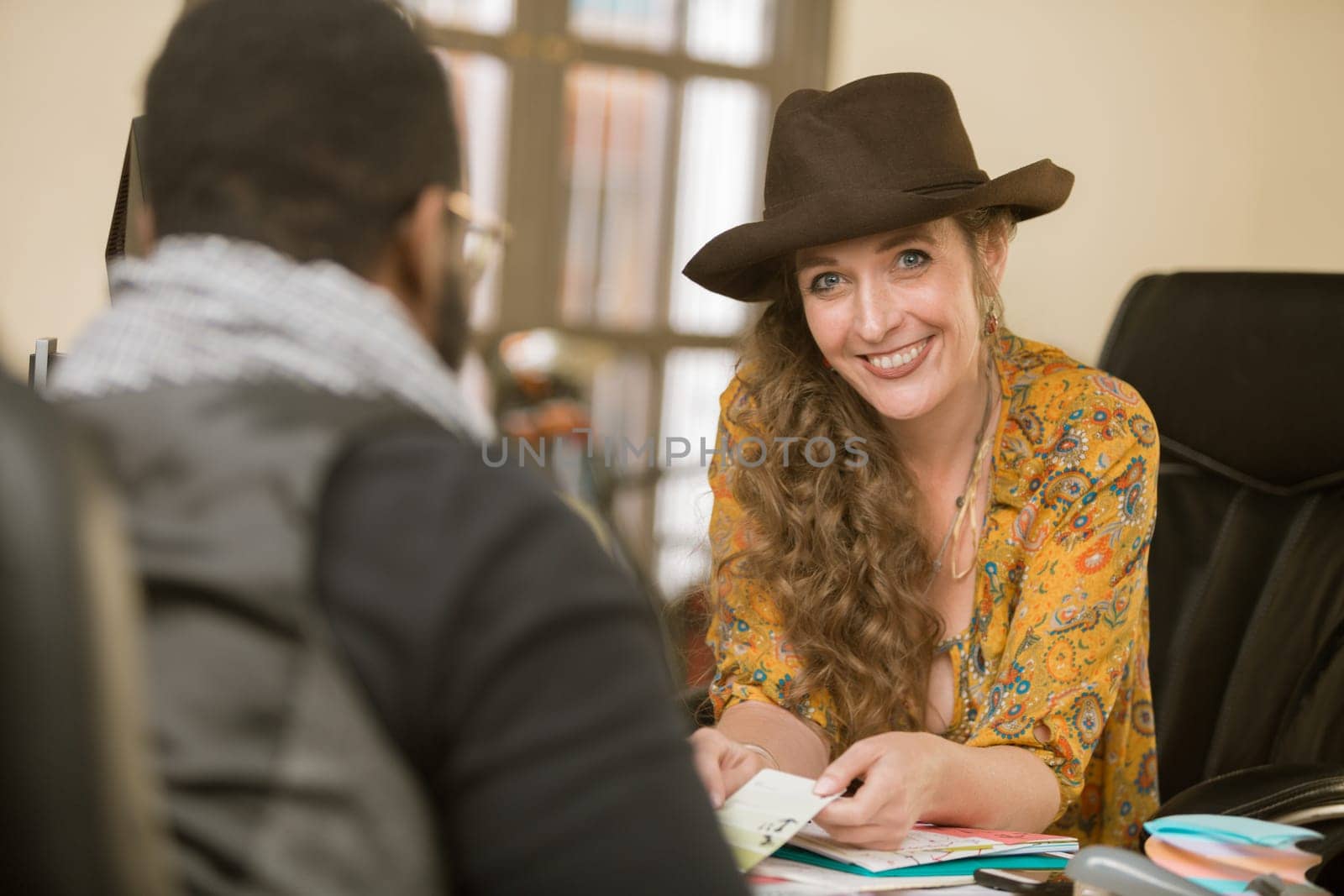 Stylish woman in her office with colleague