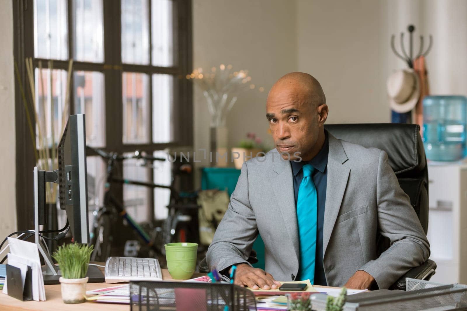 Skeptical professional man in his office