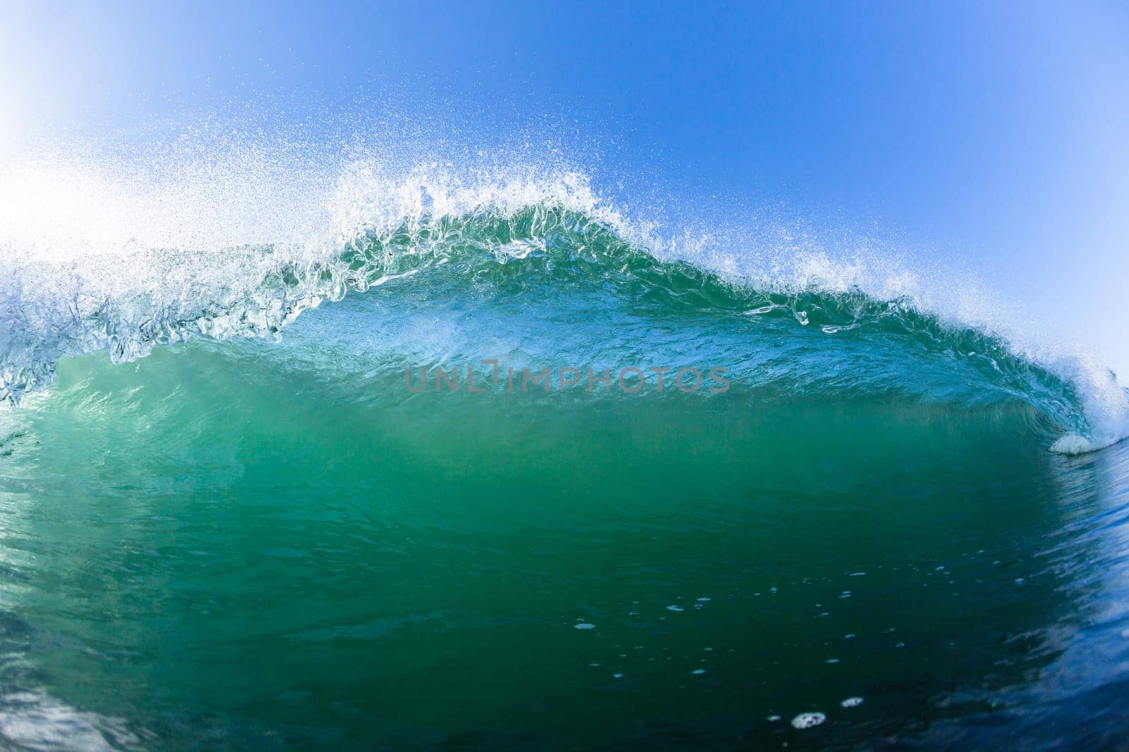 Ocean swimming closeup encounter water photo inside hollow crashing wave.