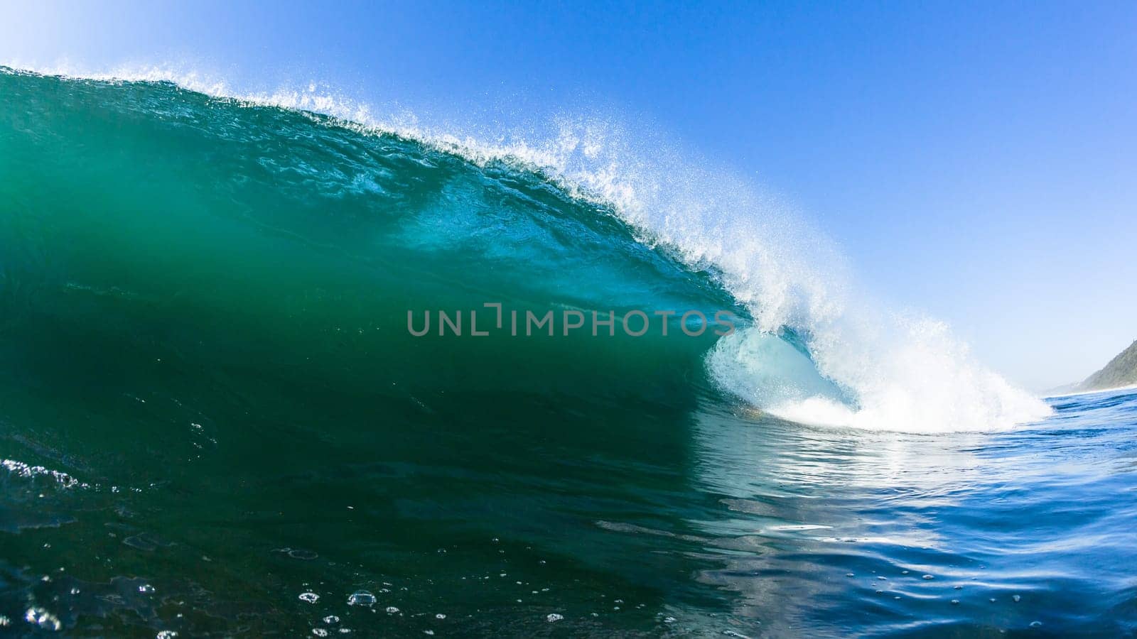 Ocean swimming closeup encounter water photo inside hollow crashing wave.