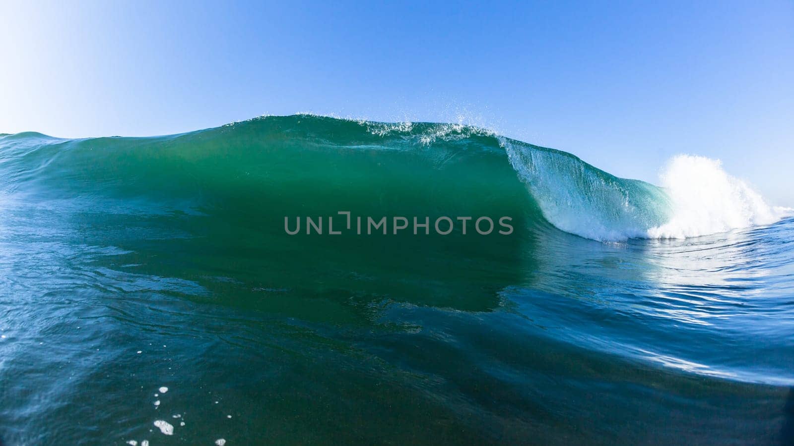 Ocean swimming closeup encounter water photo inside hollow crashing wave.