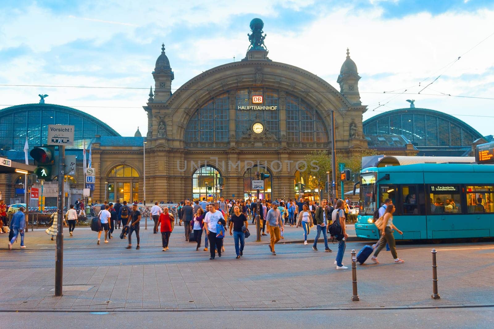 FRANKFURT, GERMANY - AUGUST 30, 2018: People walking in front of Frankfurt Main Train station. The station opened in 1899 and is the biggest in Germany