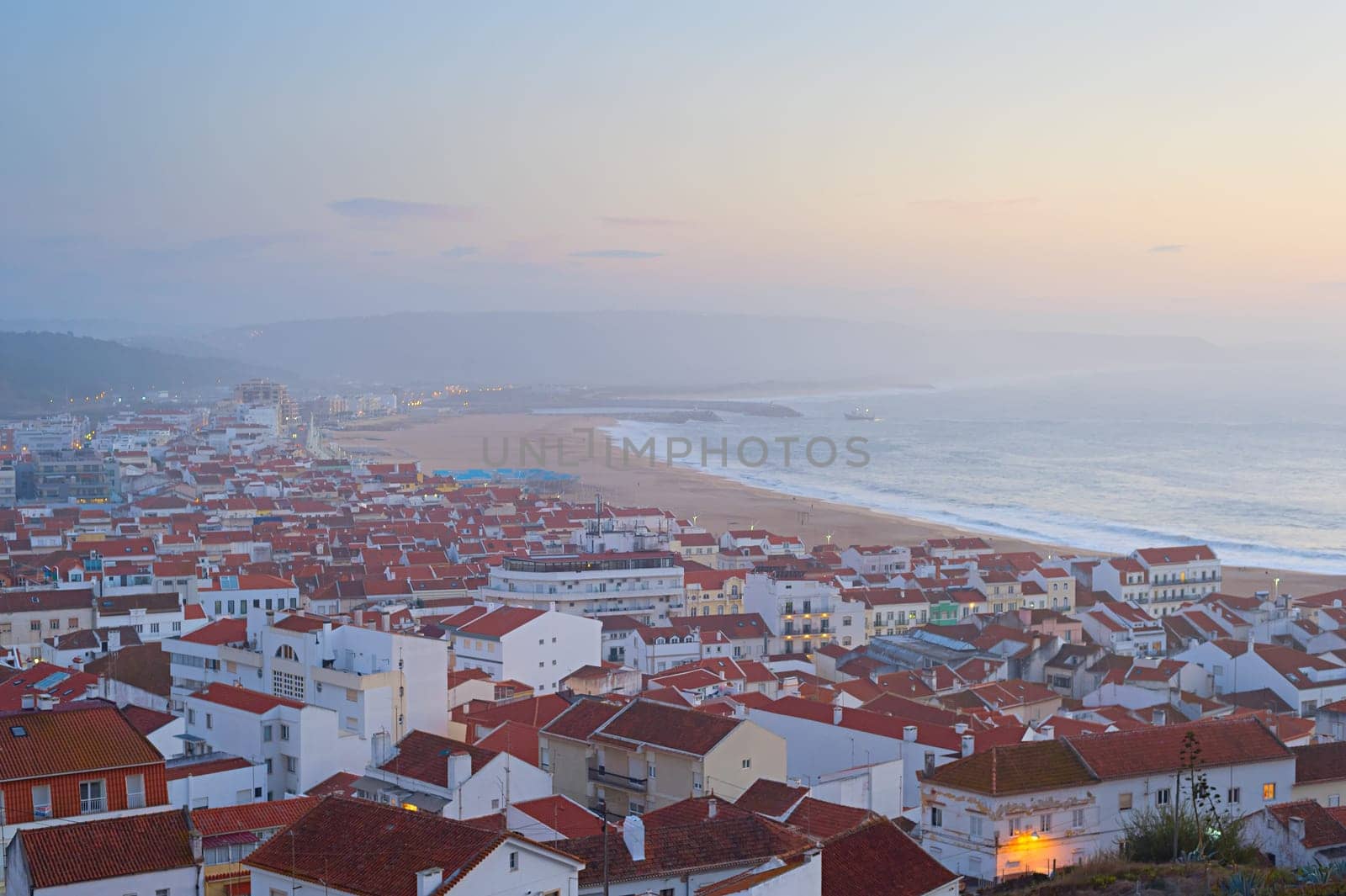 Skyline of Nazare - famous seashore Portuguese town at dusk. Portugal