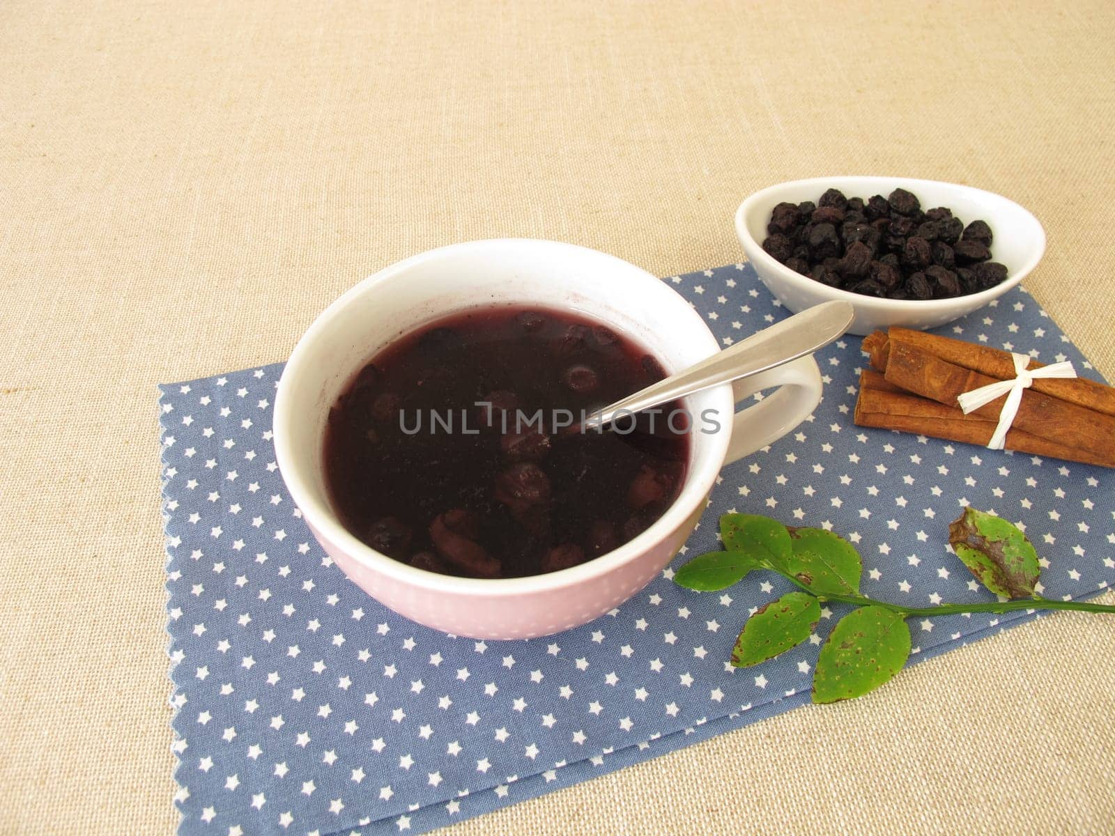 Warm blueberry soup from dried blueberries with cinnamon