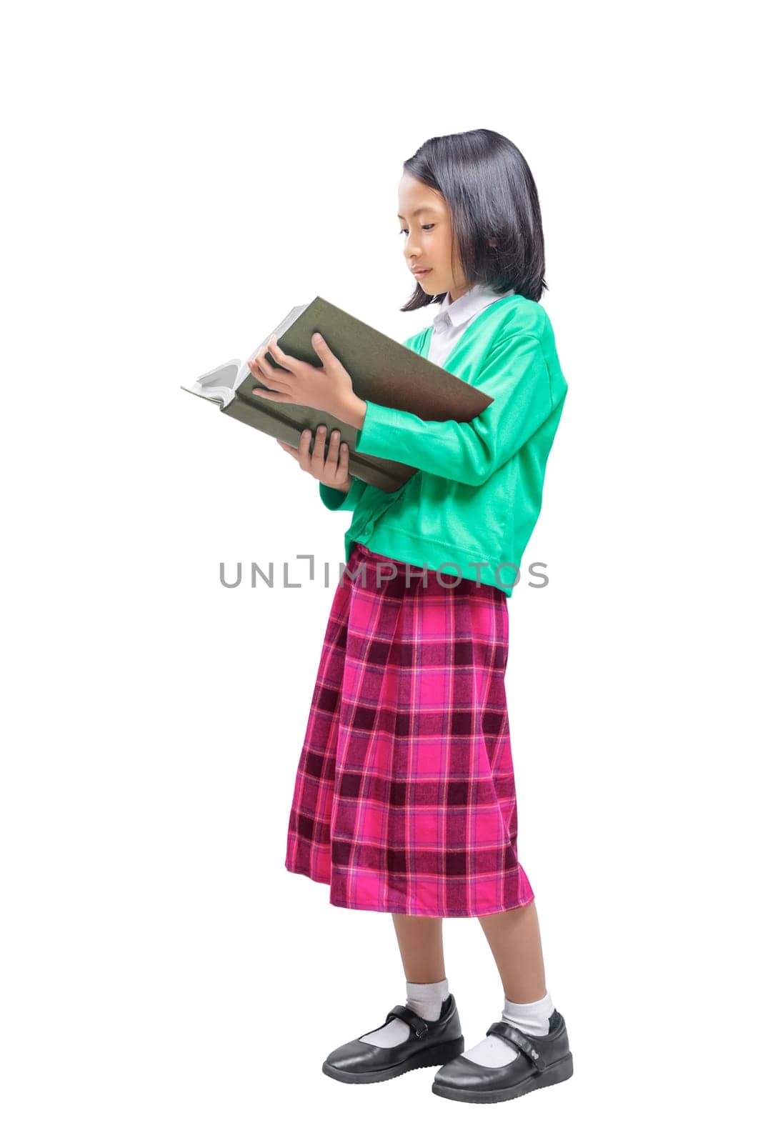 Young asian kid reading book isolated over white background