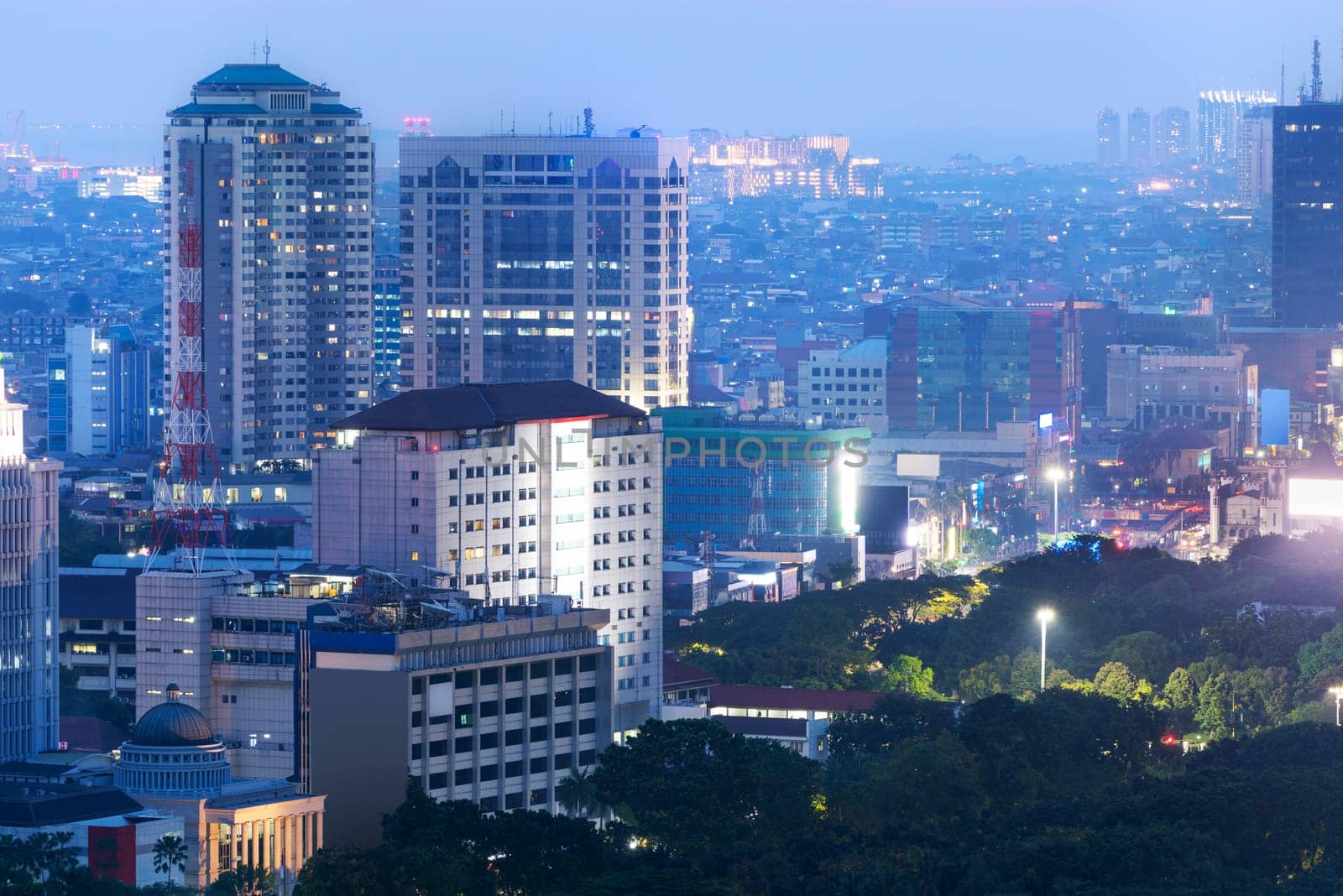 Jakarta city skyline with urban skyscrapers at night. Jakarta, Indonesia