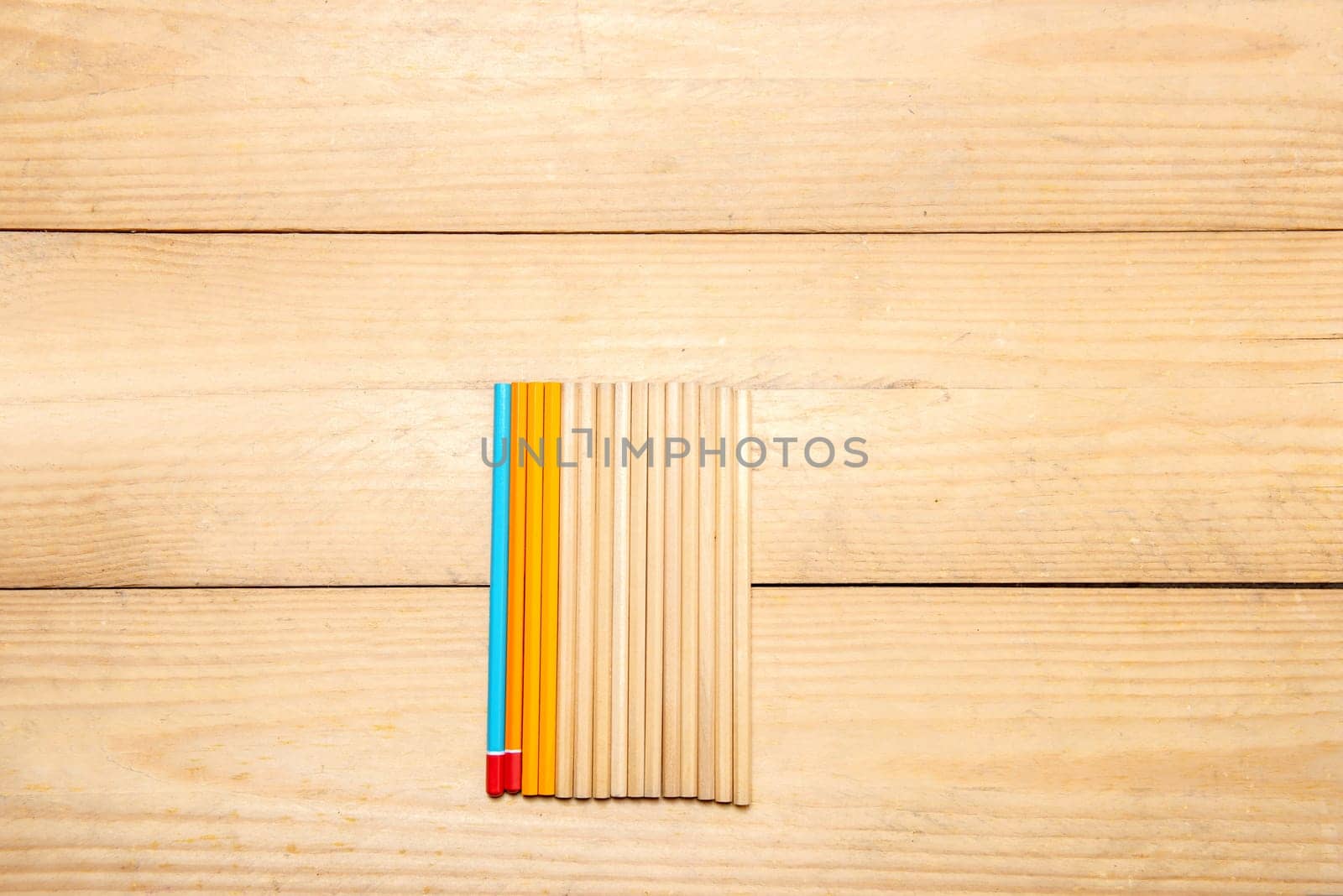 Row of stationery of pencils on the wooden table. Back to School concept