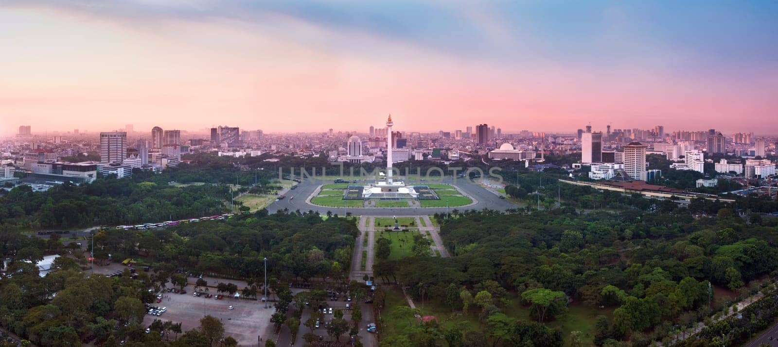 Panoramic Jakarta skyline with iconic symbol likes National Monument (Monas) in the afternoon. Jakarta, Indonesia
