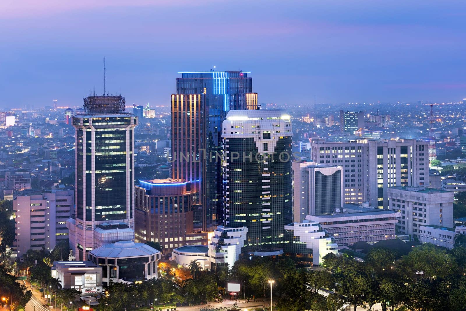 Jakarta city skyline with urban skyscrapers at night. Jakarta, Indonesia