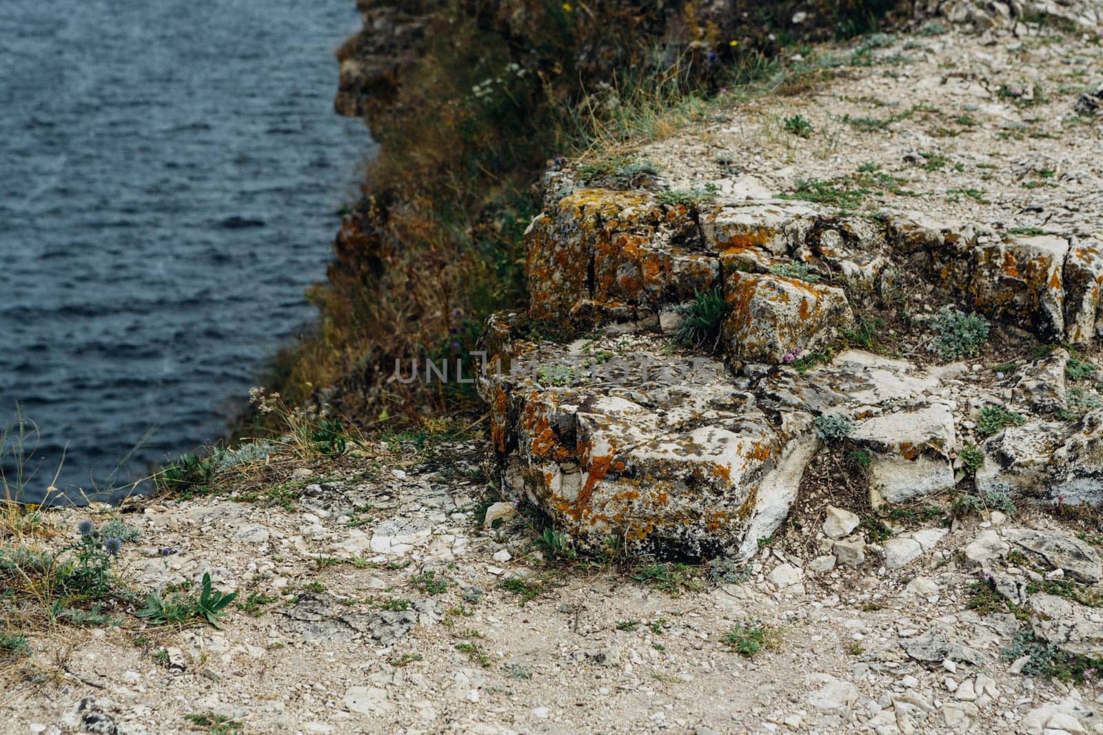 landscape river cliff grass on the sky background.