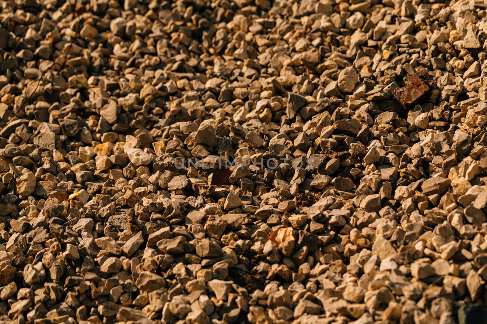 dark crushed stone close up in autumn.