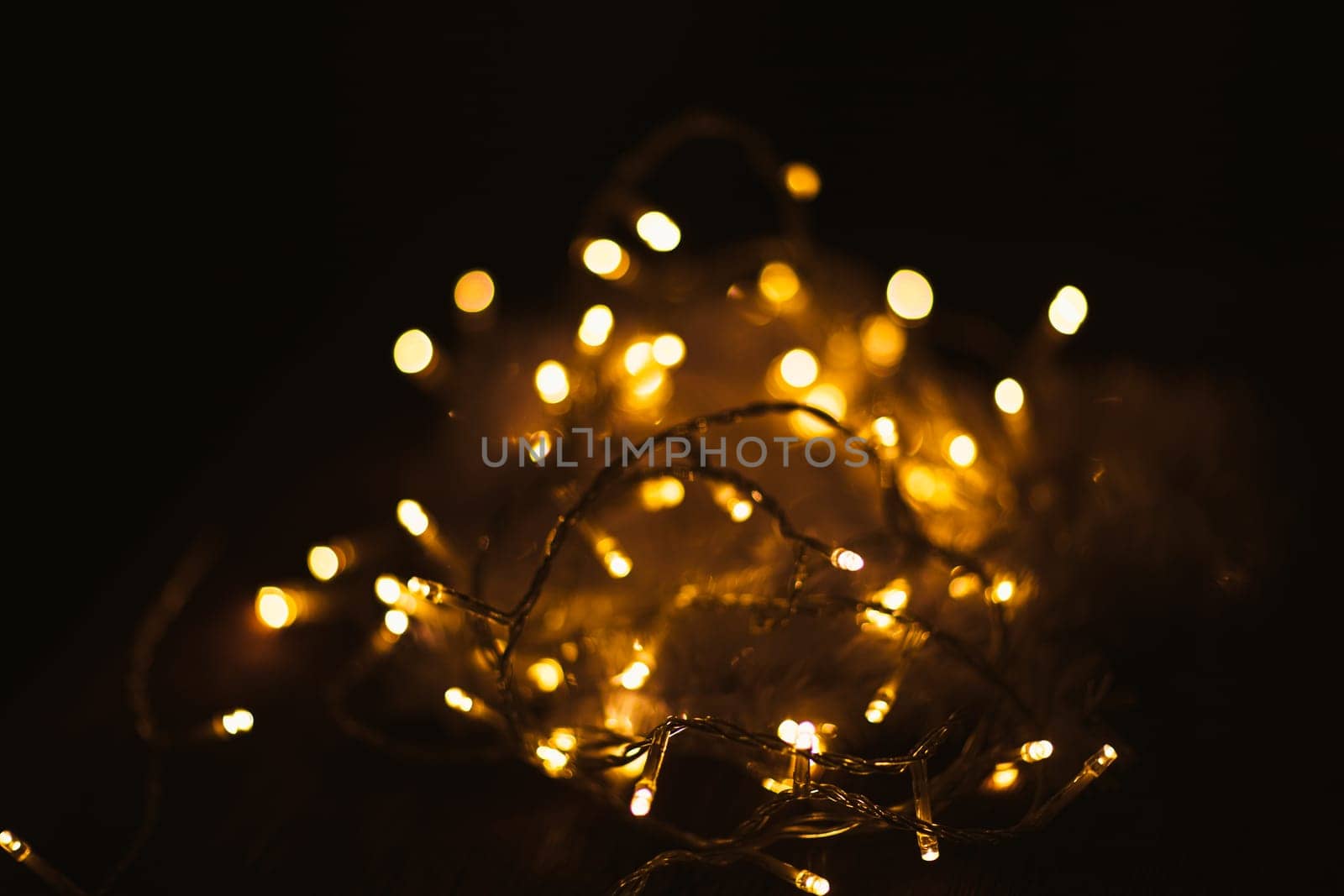 Christmas luminous garland on a dark background.