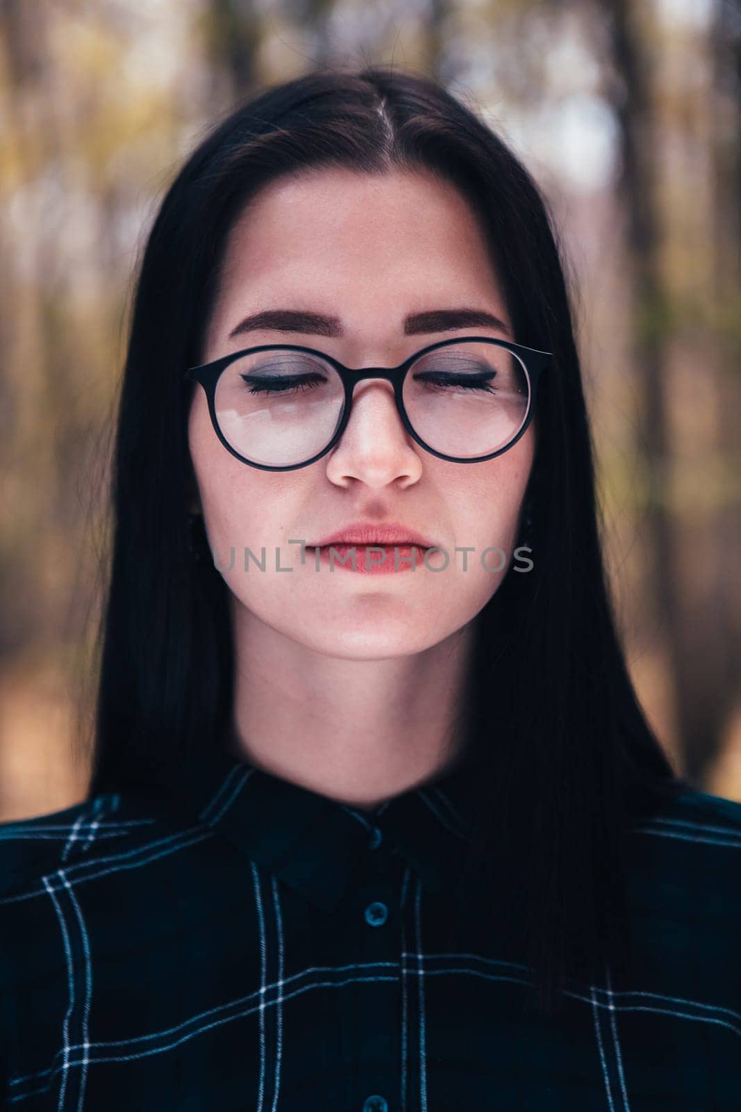 portrait of a young woman in the autumn forest.