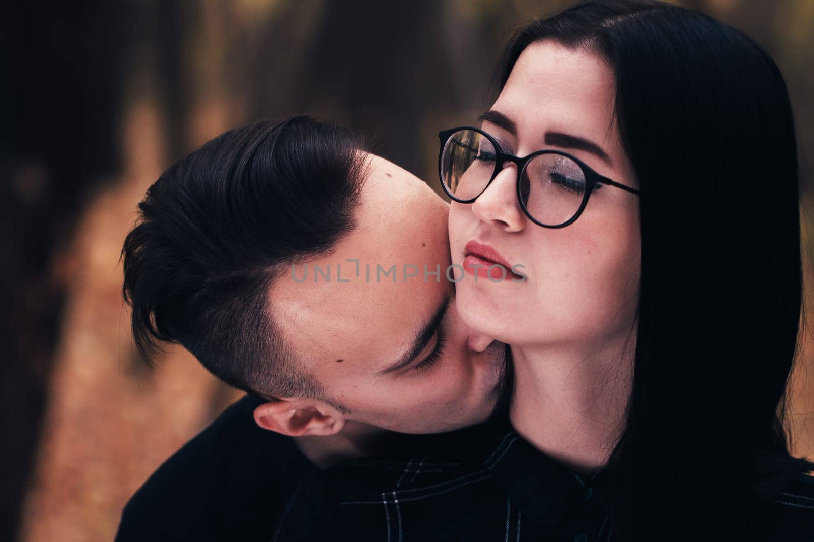 man and woman in the autumn forest