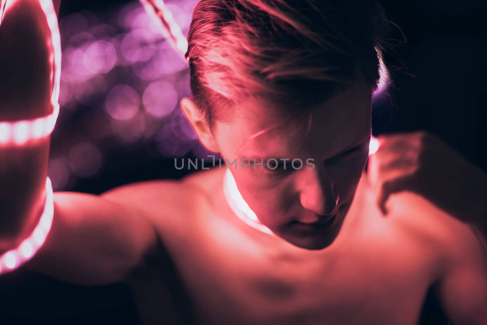 Portrait man Strip Light LED tape on dark color background.