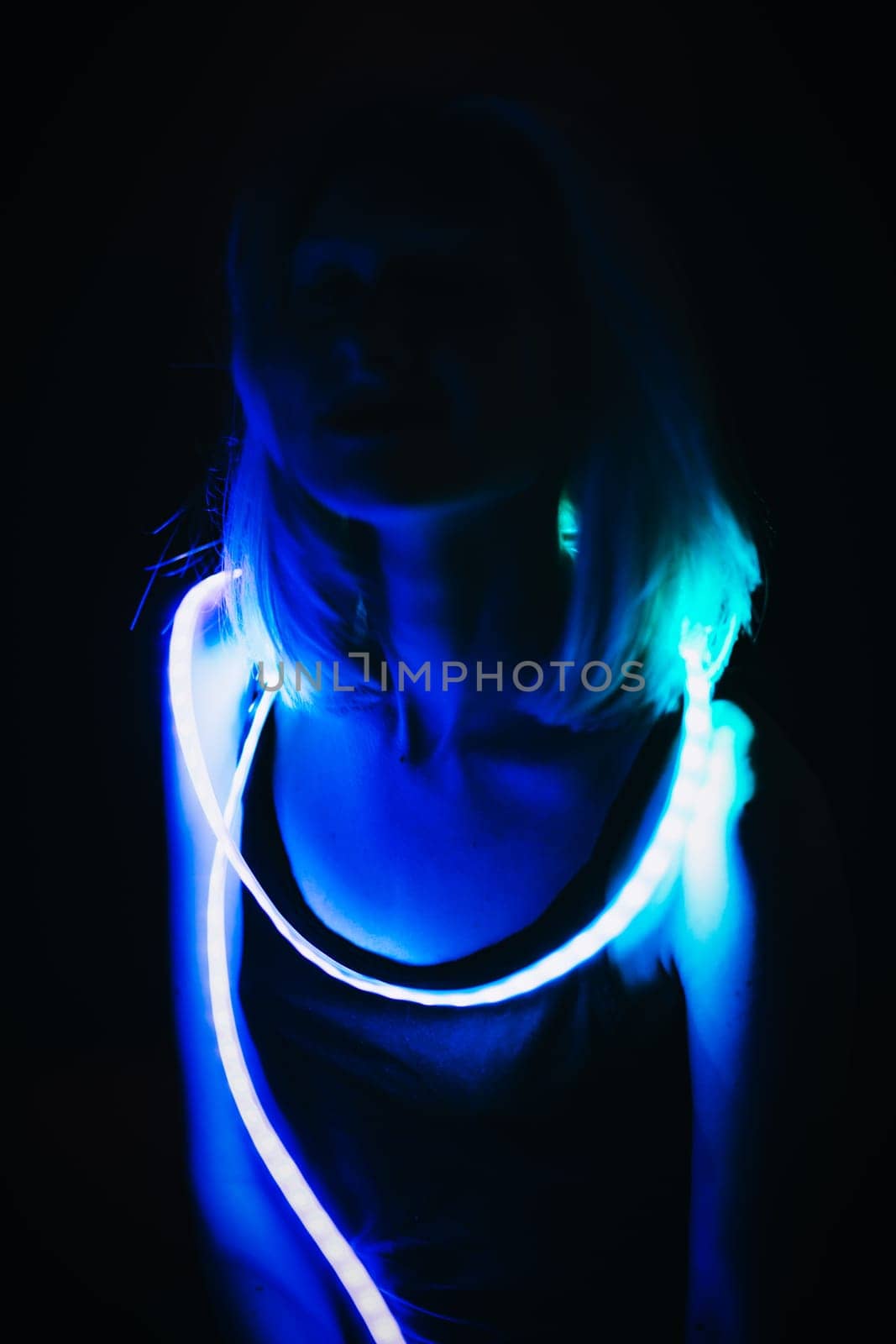 Portrait girl Strip Light LED tape on dark color background.