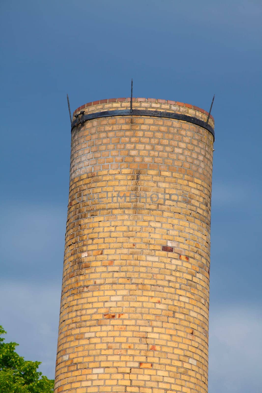 Old factory chimney from brick dark dramatic clouded sky, Lubeck, Schleswig-Holstein, Germany, Europe