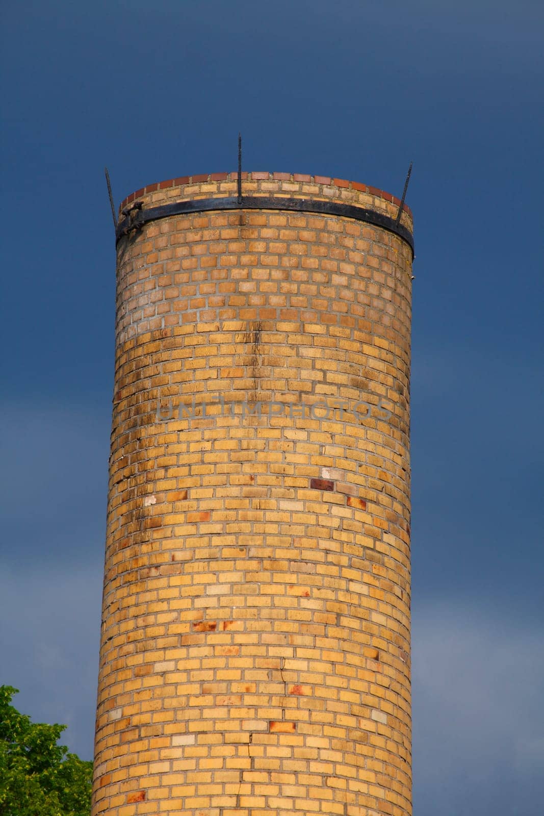 Old factory chimney from brick dark dramatic clouded sky, Lubeck, Schleswig-Holstein, Germany, Europe