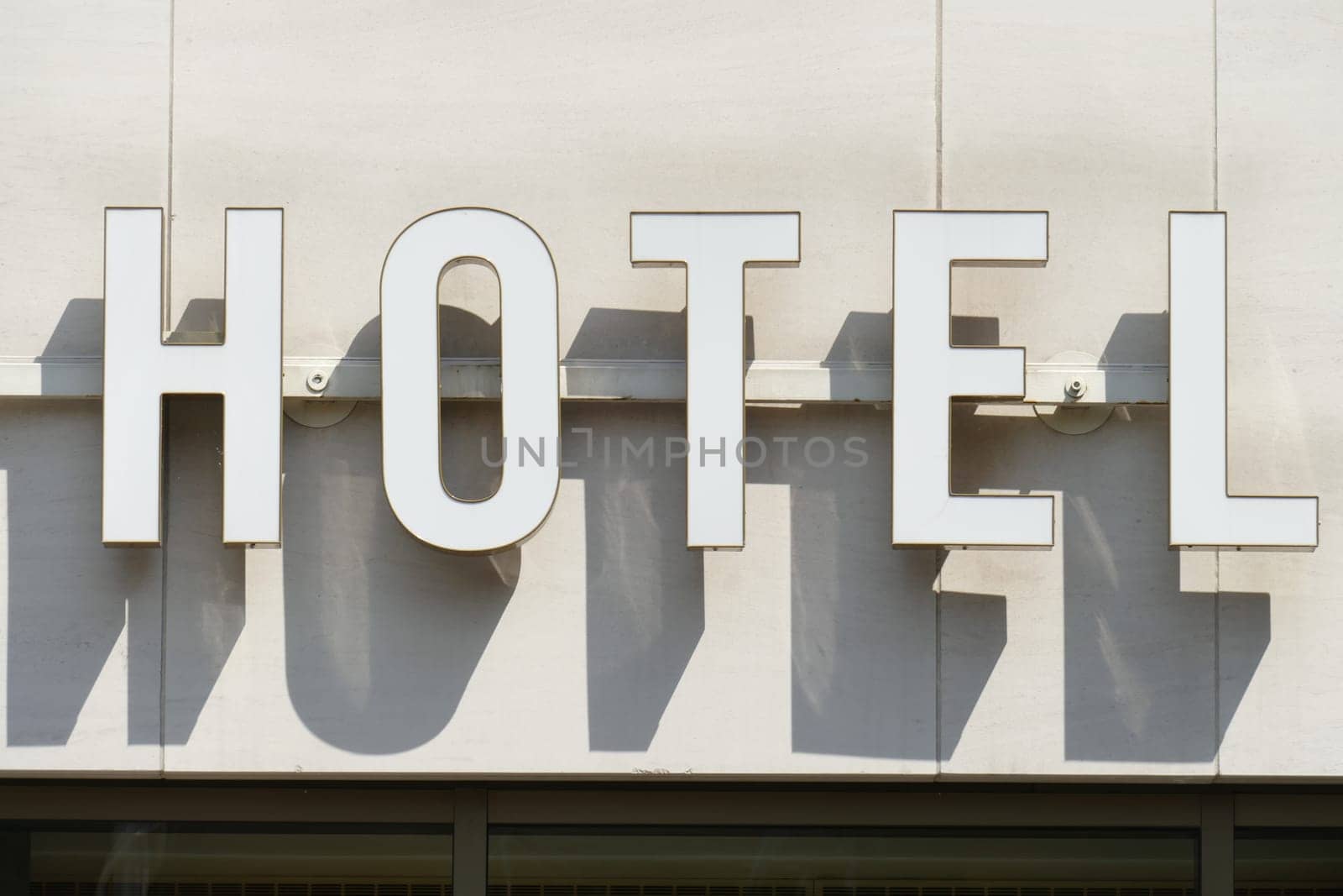 White hotel sign with shadow, Germany, Europe