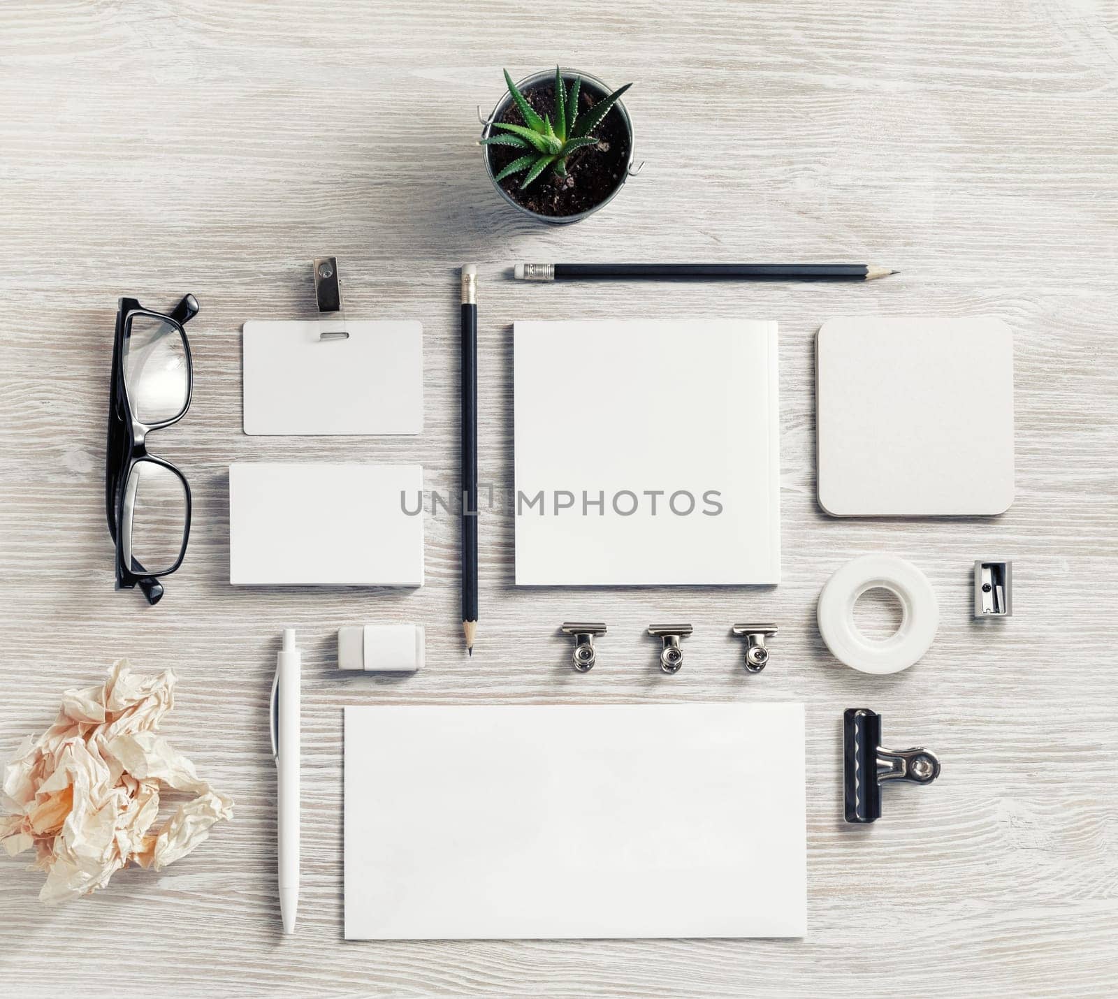 Blank stationery set. Corporate identity template on light wooden background. Flat lay.
