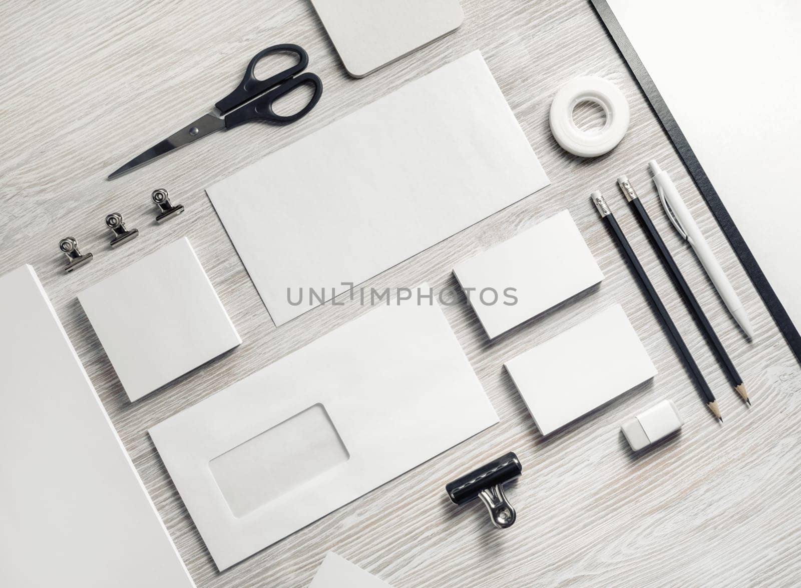 Blank corporate stationery set on light wood table background. Template for branding design. Branding mock up.