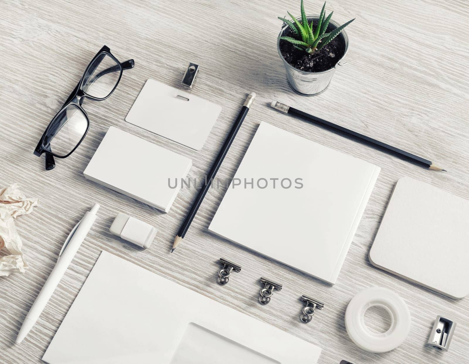 Corporate identity template. Blank stationery mock up on light wooden background.