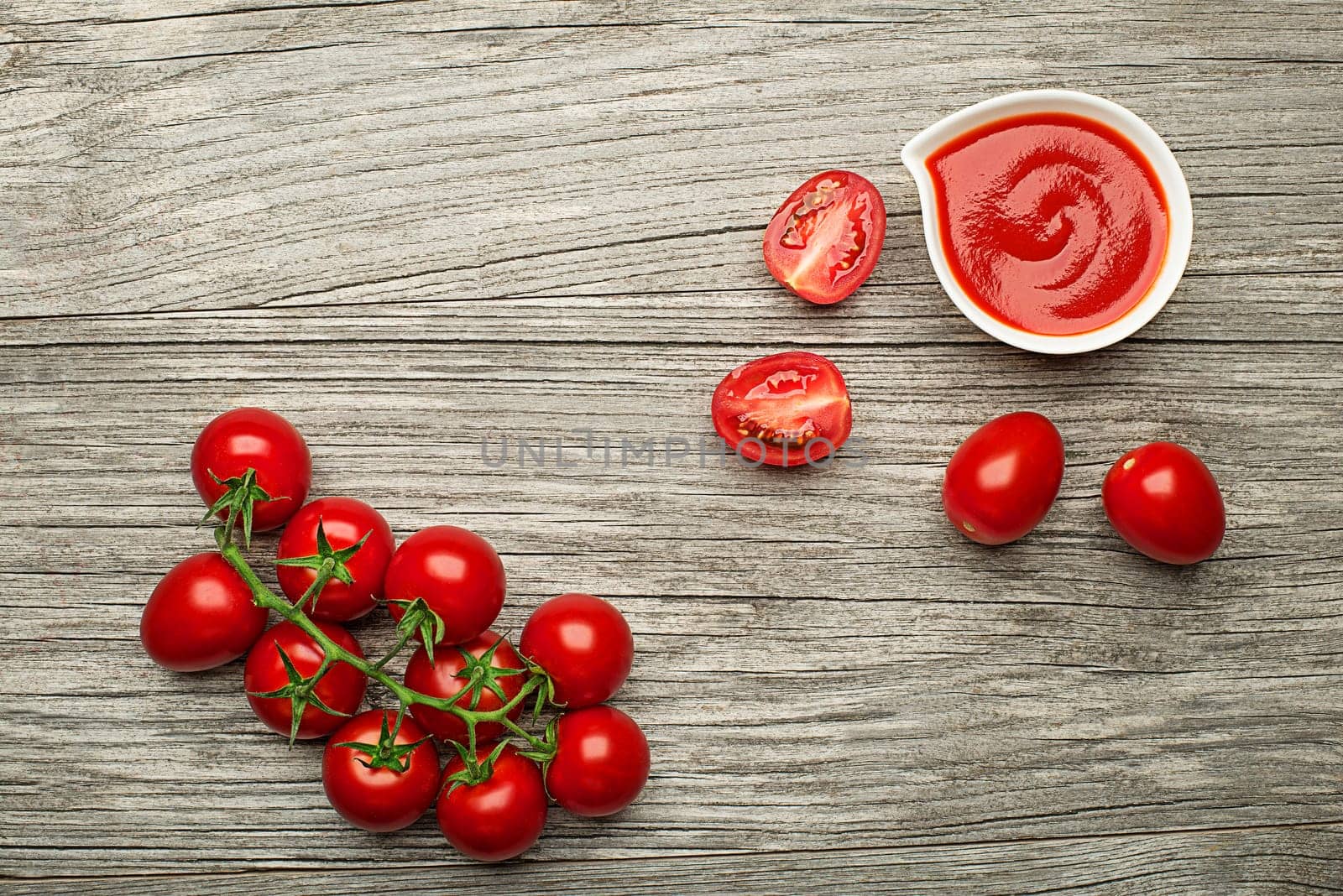 Fresh tomatoes for cooking tomato sauce or soup on wooden background place for text. Vegan food vegetarian and healthy cooking concept.
