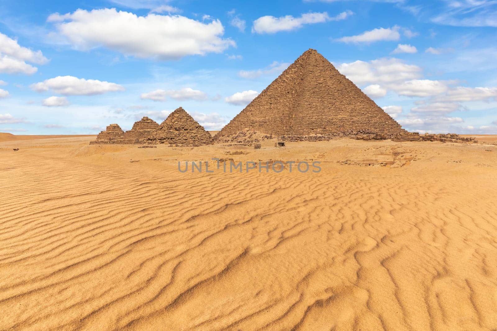 The Pyramid of Menkaure and the small pyramids in the beautiful desert of Giza, Egypt.