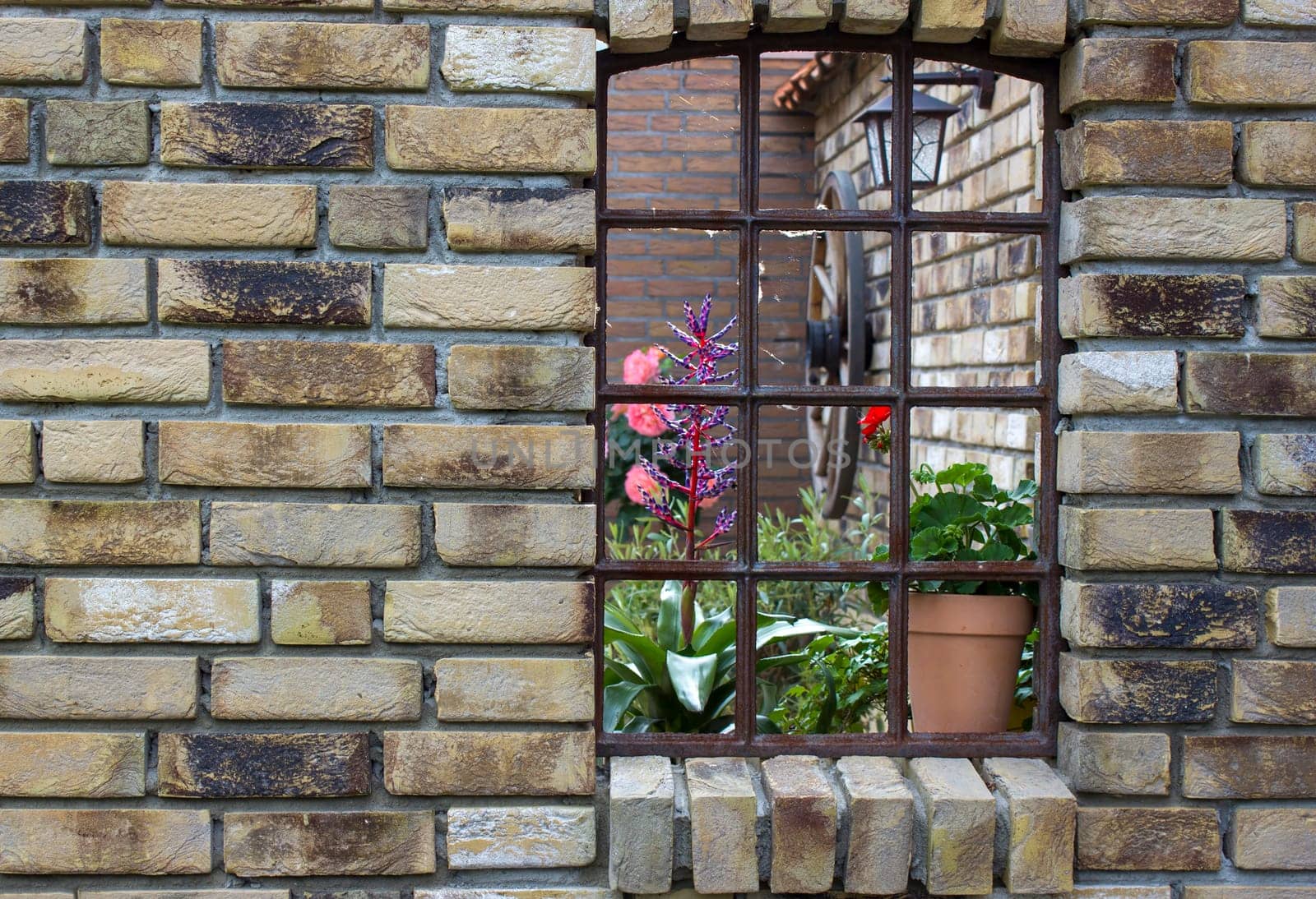 beautiful place in the garden in the mediterranean style, old window with flowers