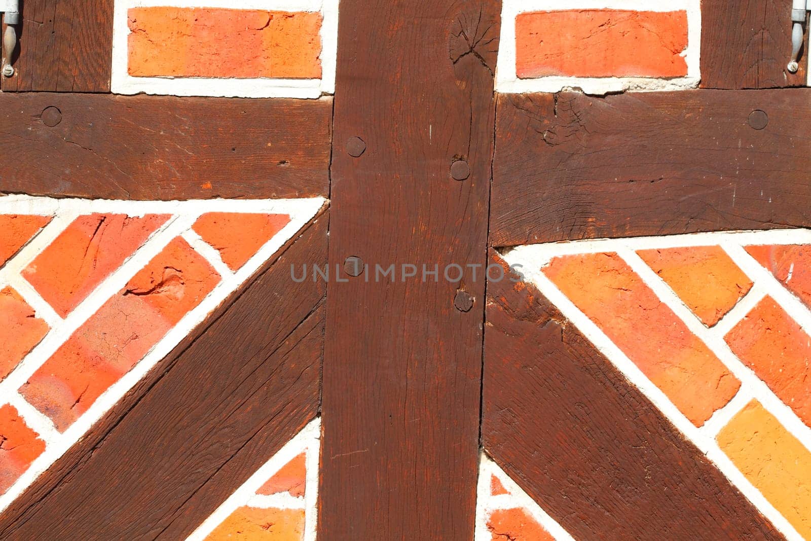 Brick wall with timber beam, Eutin, Holstein Switzerland, Schleswig-Holstein, Germany, Europe..