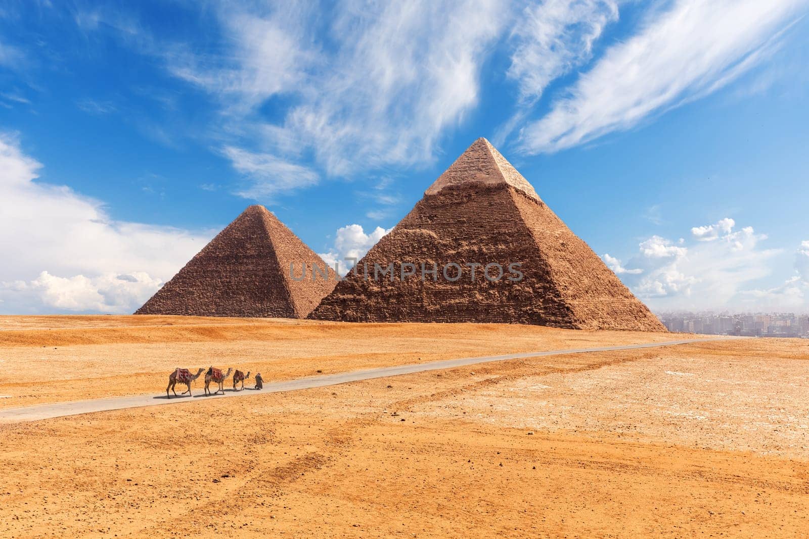 The Giza Pyramids in the desert, sunny day scenery.