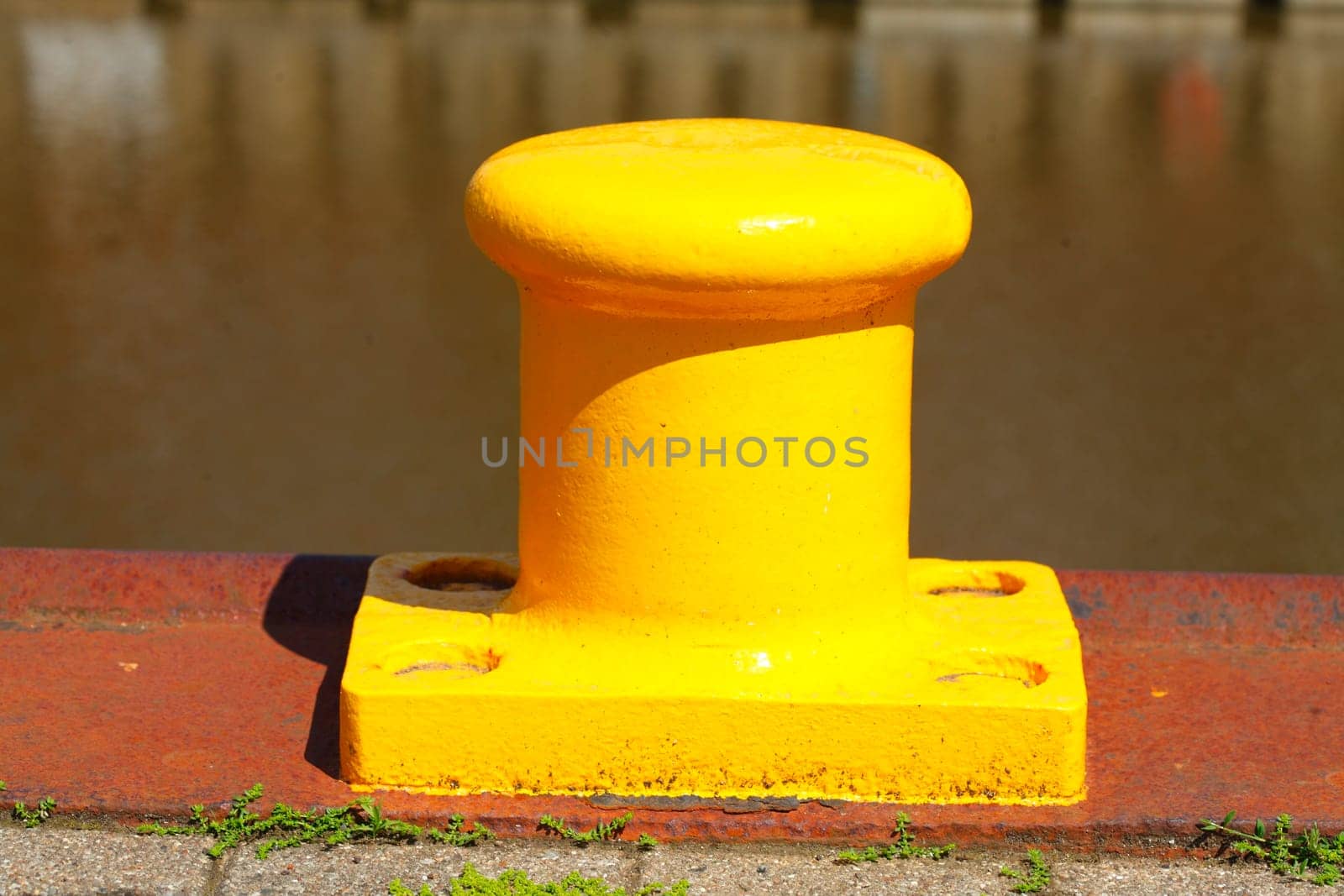 Yellow bollard, bollard in the harbor