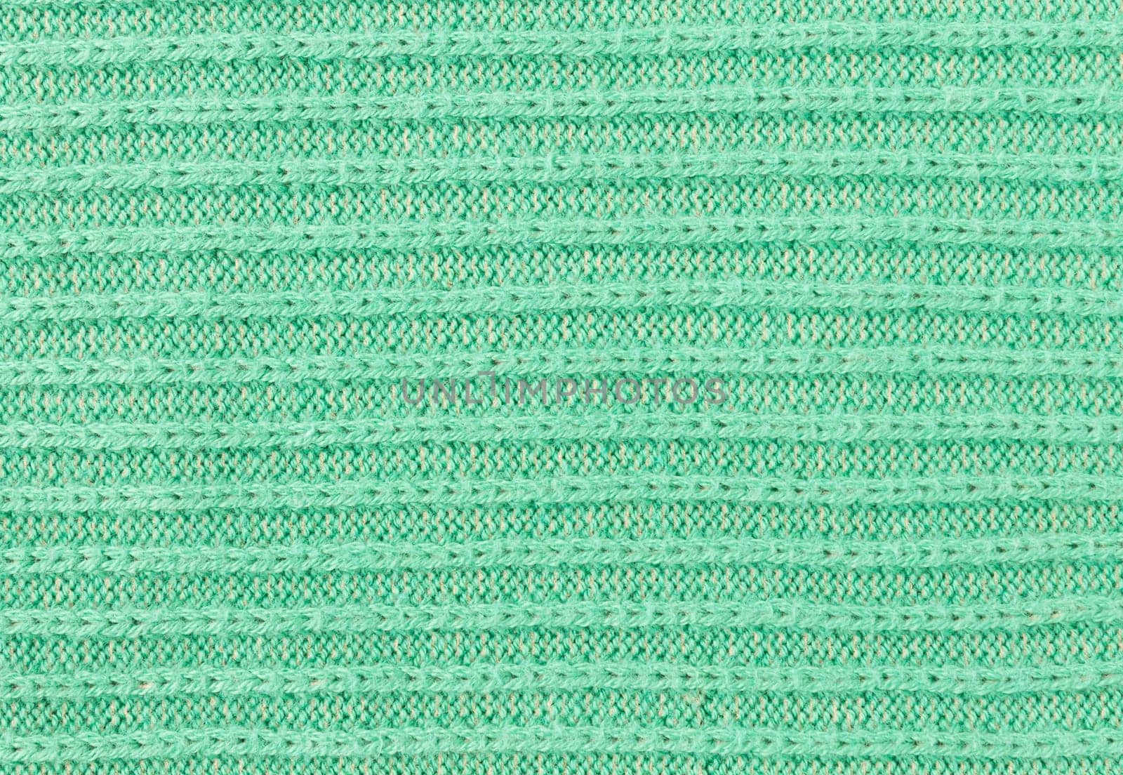 Green Knitting Texture or Knitted Texture Background in macro style. Knitting Texture or Knitted Texture in vintage style for design