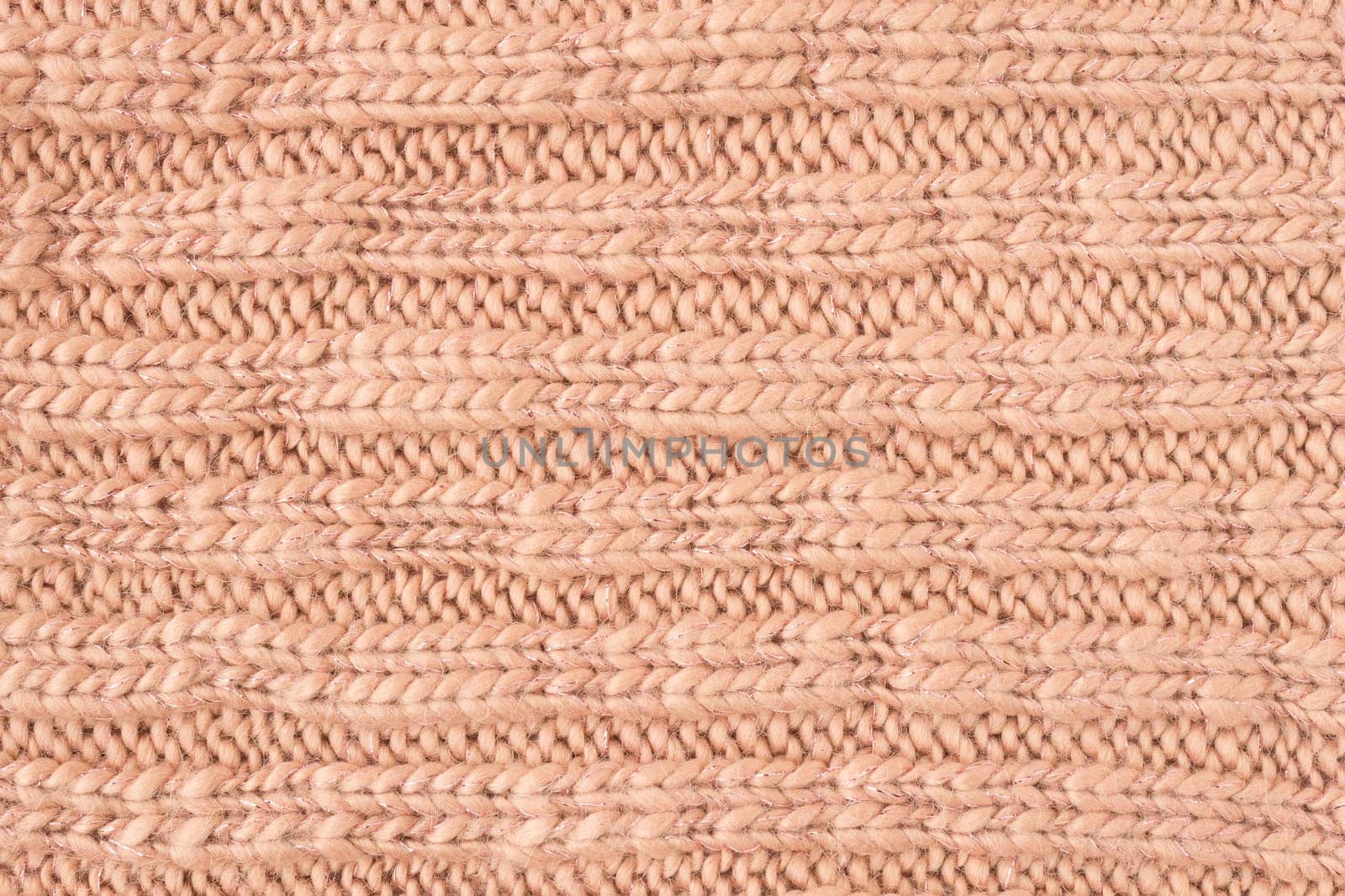 Brown Knitting Texture or Knitted Texture Background in macro style. Knitting Texture or Knitted Texture in vintage style for design