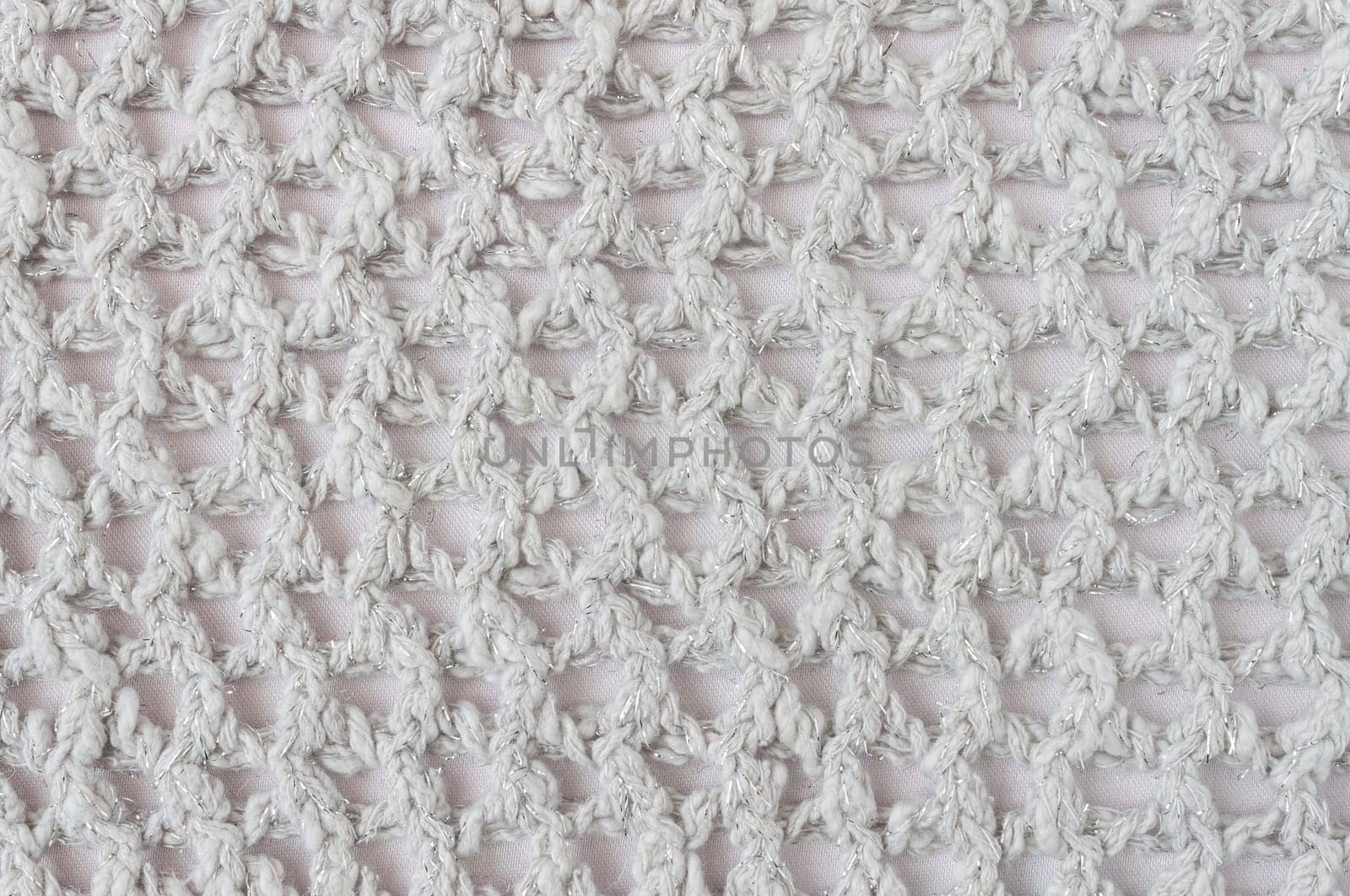 White Knitting Pattern or Knitted Pattern Background in macro style. Knitting Pattern or Knitted Pattern in vintage style for design