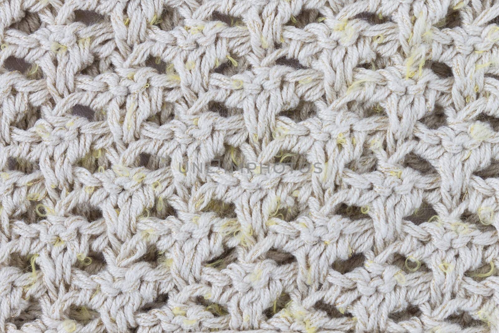 Yellow Knitting Texture or Knitted Texture Background in macro style. Knitting Texture or Knitted Texture in vintage style for design
