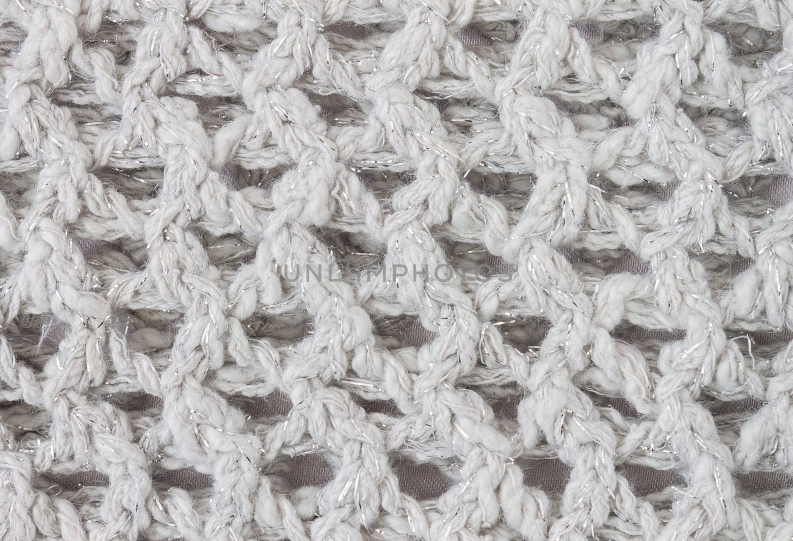 White Knitting Texture or Knitted Texture Background in macro style. Knitting Texture or Knitted Texture in vintage style for design