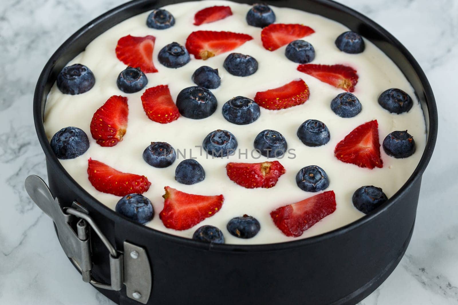 Berry dessert on the basis of yogurt in metal form
