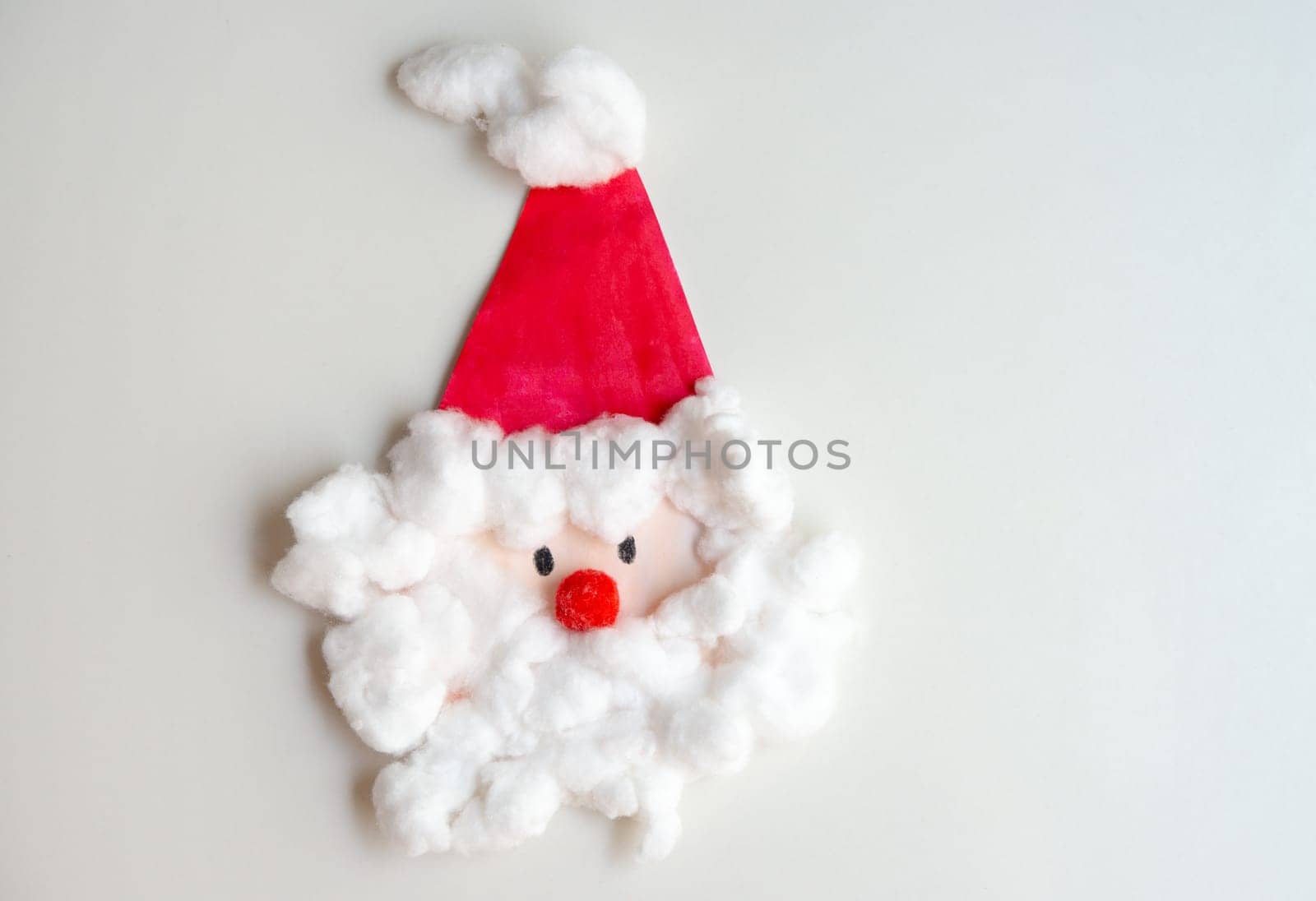Child artwork, handmade Santa Claus on white background.