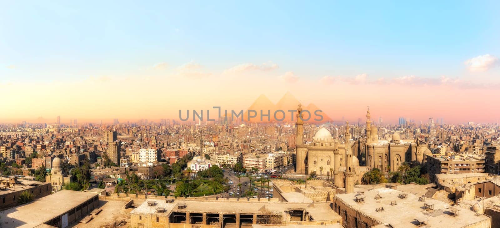 Sights of Cairo panorama: the Mosque-Madrassa of Sultan Hassan, the city view and the Pyramids.