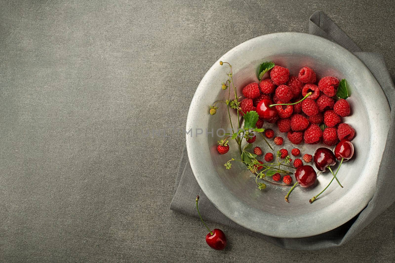 Berries with green leaf close up. Healthy food with fresh berry fruit.