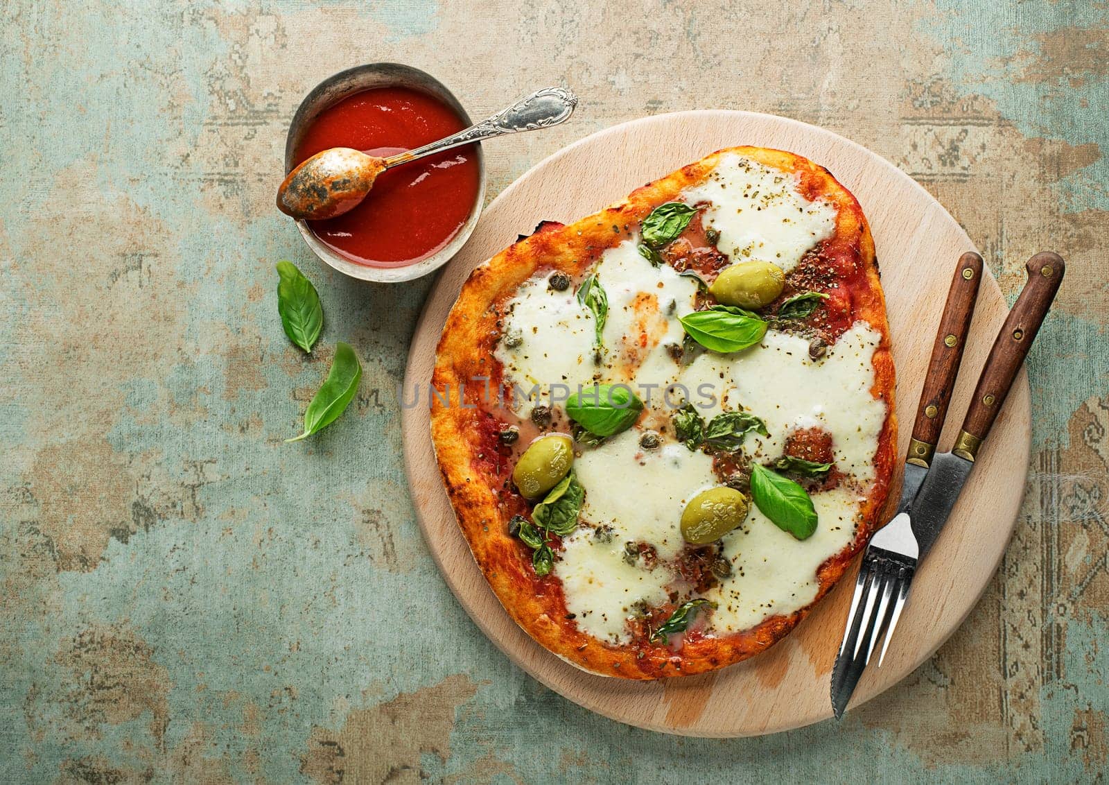 Pizza Margherita served with mozzarella cheese, tomato sauce and fresh basil