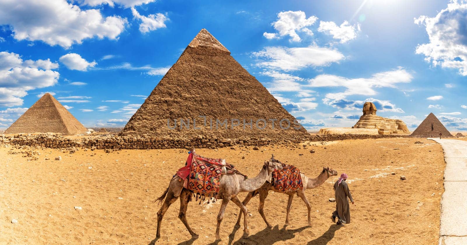 Bedouin with camels in front of the Pyramids and the Sphinx, Giza.